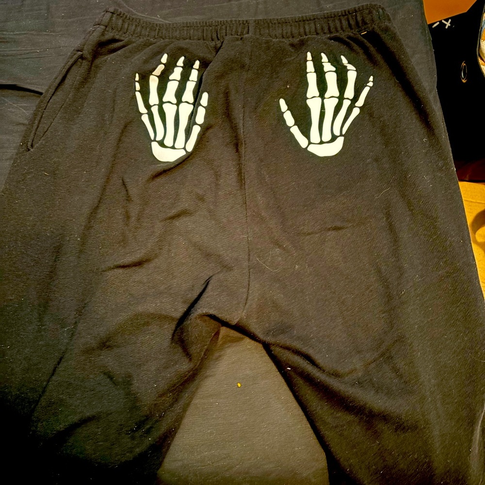 PINK skeleton hand cheek sweatpants